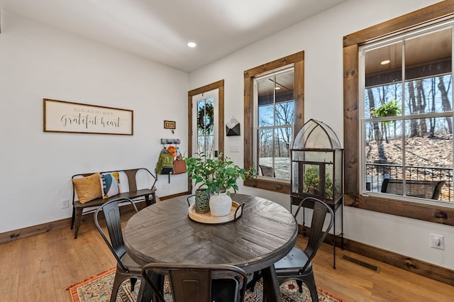 dining area featuring visible vents, recessed lighting, baseboards, and light wood-type flooring