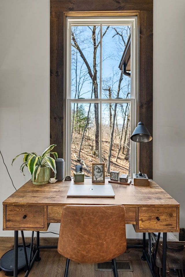 home office with visible vents and dark wood-style flooring