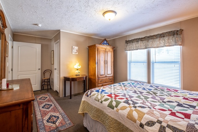 carpeted bedroom with ornamental molding and a textured ceiling