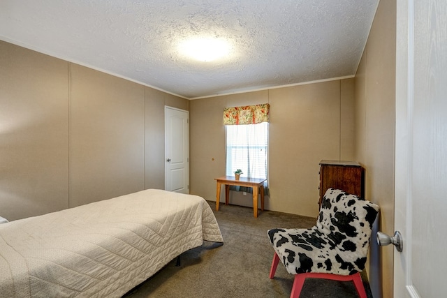 carpeted bedroom featuring crown molding and a textured ceiling