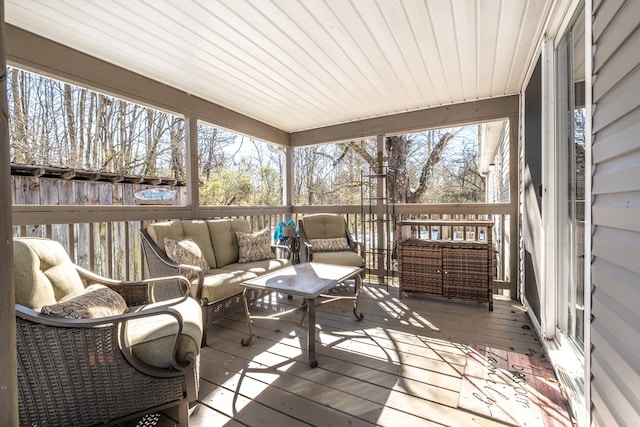 sunroom / solarium featuring wood ceiling and a wealth of natural light