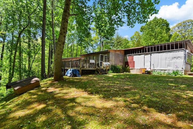 view of yard with a wooden deck