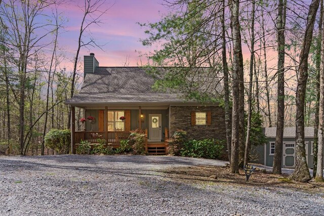 149 Pinecrest Ct, Ellijay, GA 30540 - view of front facade featuring covered porch, a chimney, a shingled roof, and board and batten siding