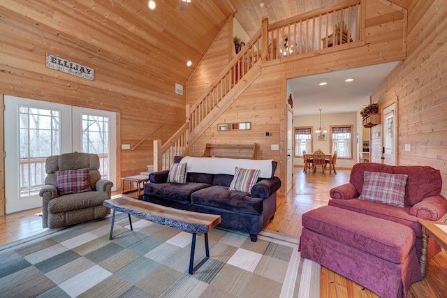 149 Pinecrest Ct, Ellijay, GA 30540 - living room with stairs, wood walls, high vaulted ceiling, recessed lighting, and wood finished floors