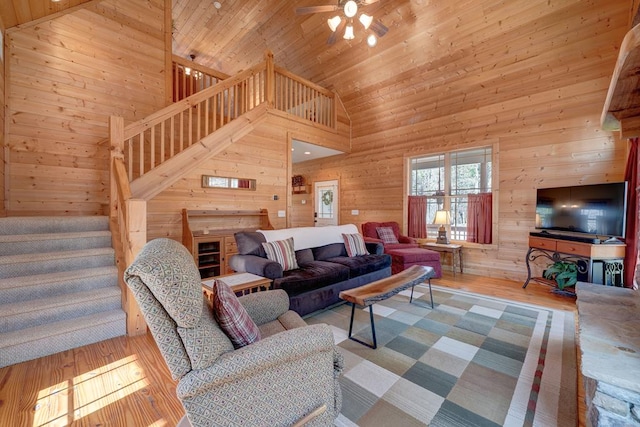 149 Pinecrest Ct, Ellijay, GA 30540 - living room with stairs, wooden walls, wooden ceiling, wood finished floors, and high vaulted ceiling
