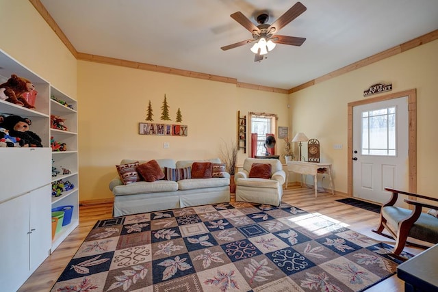 149 Pinecrest Ct, Ellijay, GA 30540 - living area featuring light wood-style flooring, crown molding, ceiling fan, and baseboards