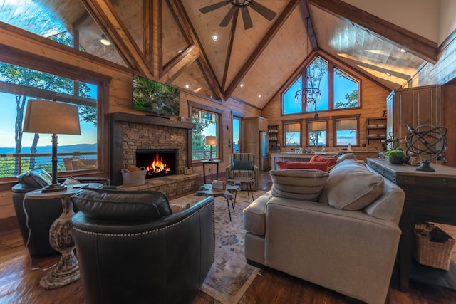 living room featuring beamed ceiling, wooden walls, hardwood / wood-style floors, a fireplace, and high vaulted ceiling