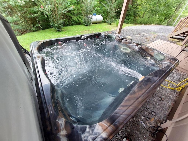 exterior details with a jacuzzi and heating fuel