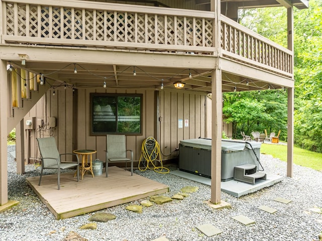 view of patio / terrace featuring a deck and a hot tub