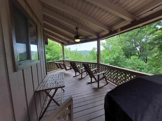 wooden terrace featuring ceiling fan