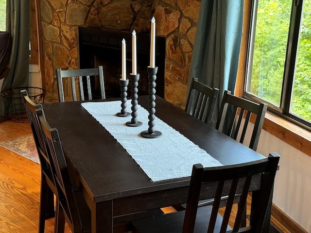 dining space with hardwood / wood-style floors