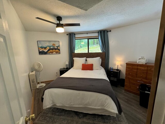 bedroom featuring a textured ceiling and hardwood / wood-style floors