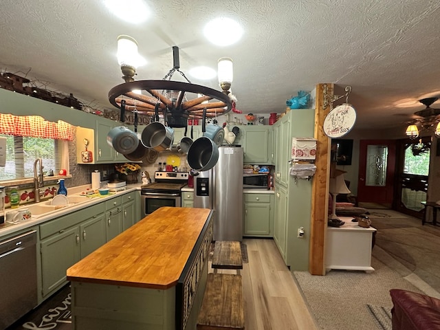 10 Whippoorwill Ln, Murphy, NC 28906 - kitchen featuring green cabinets, stainless steel appliances, wooden counters, a chandelier, and a sink