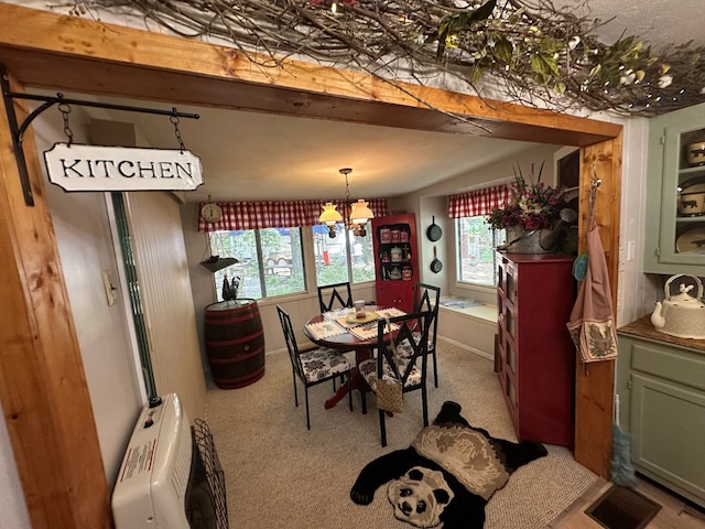 10 Whippoorwill Ln, Murphy, NC 28906 - carpeted dining space with a chandelier and healthy amount of natural light