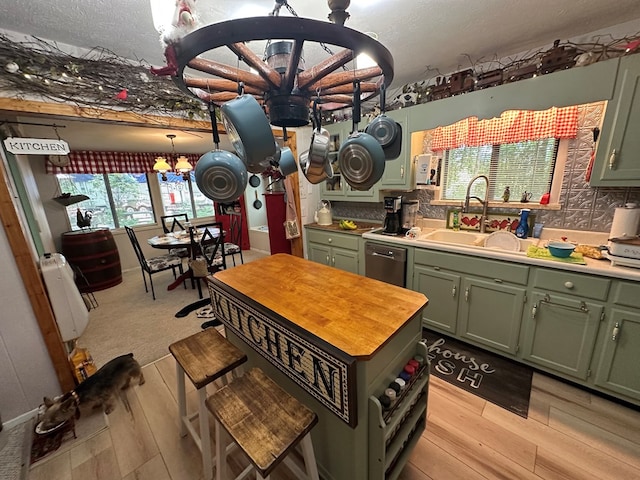 10 Whippoorwill Ln, Murphy, NC 28906 - kitchen with green cabinetry, a sink, a chandelier, light wood finished floors, and dishwasher