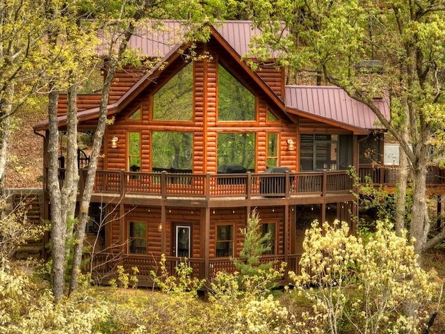 rear view of property featuring a balcony