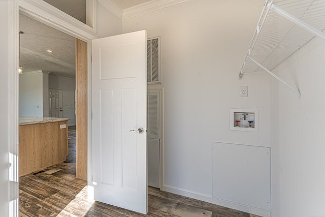 clothes washing area with crown molding, dark hardwood / wood-style flooring, and hookup for a washing machine