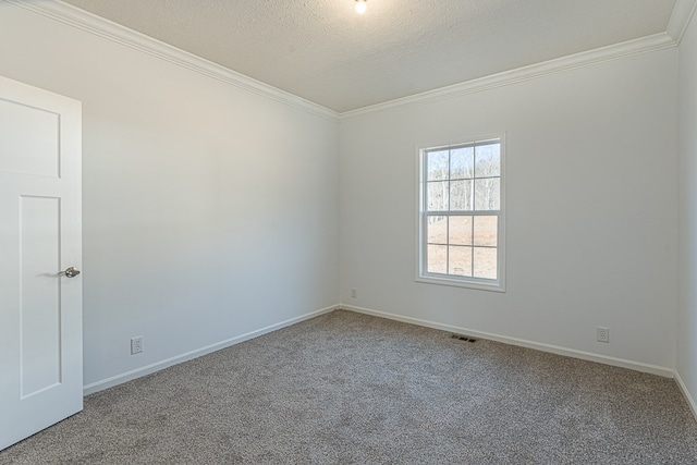 unfurnished room with crown molding, carpet floors, and a textured ceiling