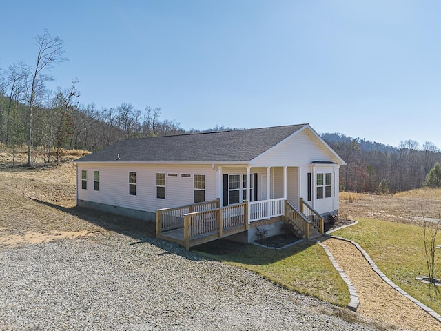 view of front of house with a wooden deck