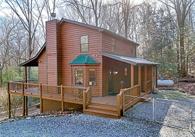 rear view of property with a deck