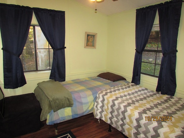 bedroom with hardwood / wood-style flooring