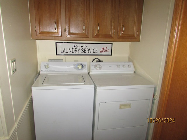 laundry area with cabinets and washing machine and dryer