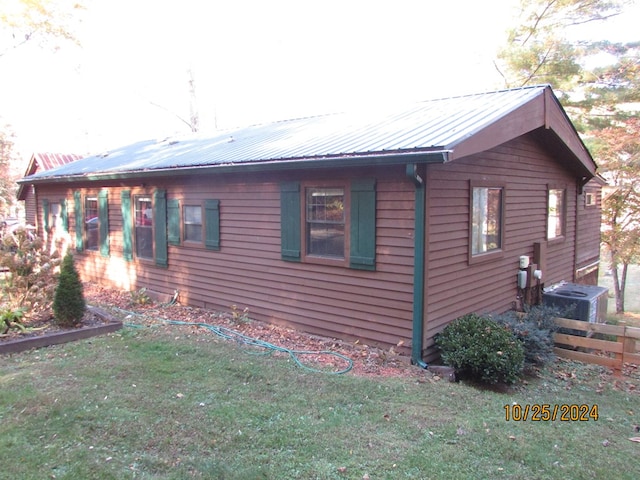 view of property exterior with a yard