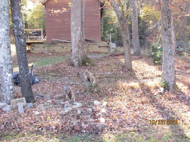 view of yard featuring a wooden deck