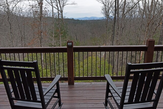 deck featuring a view of trees