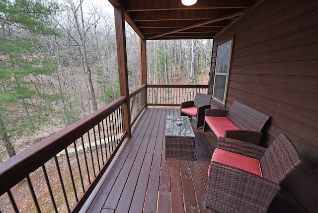 deck featuring a view of trees