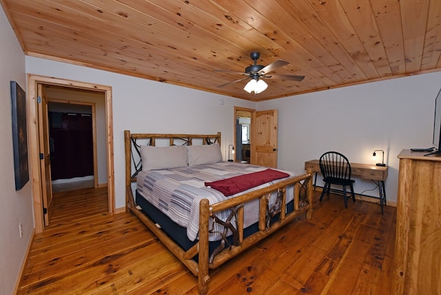 bedroom featuring ornamental molding, wooden ceiling, baseboards, and hardwood / wood-style flooring