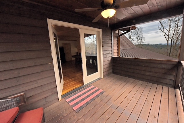 wooden terrace featuring a ceiling fan