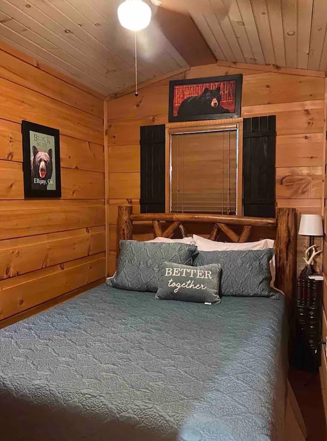 carpeted bedroom featuring lofted ceiling, wood walls, and wooden ceiling