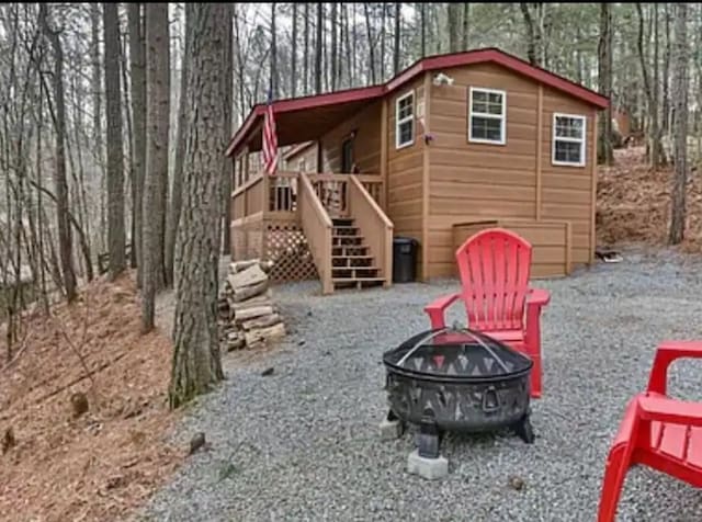 exterior space with an outdoor fire pit