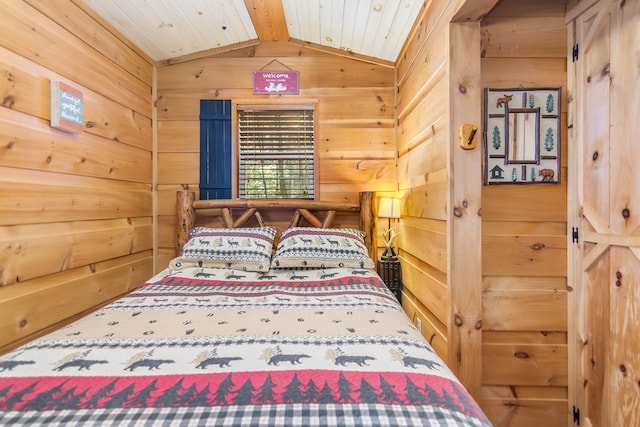 bedroom with vaulted ceiling with beams, wooden ceiling, and wood walls