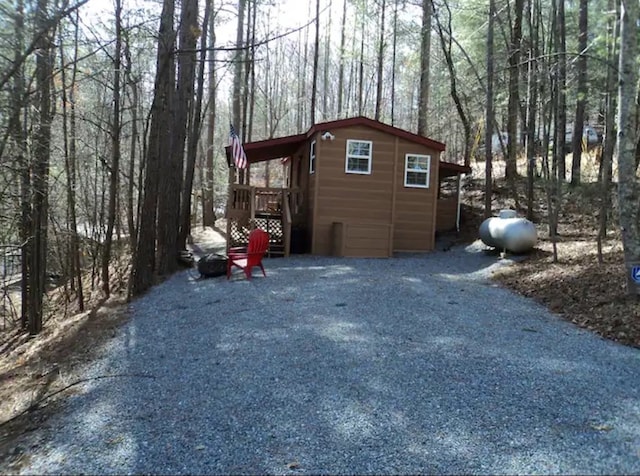 view of side of home with a deck