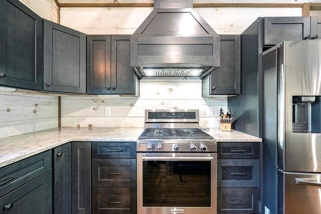 1085 Dills Rd, Blue Ridge, GA 30513 - kitchen with stainless steel appliances, premium range hood, and light stone countertops