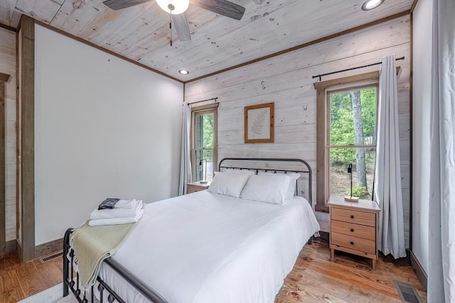 1085 Dills Rd, Blue Ridge, GA 30513 - bedroom with multiple windows, light wood finished floors, wood ceiling, wood walls, and recessed lighting