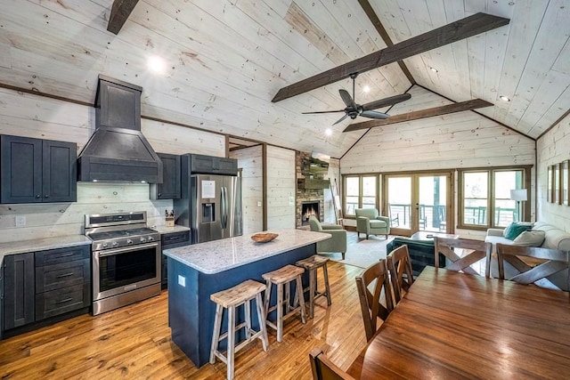 1085 Dills Rd, Blue Ridge, GA 30513 - kitchen featuring appliances with stainless steel finishes, custom exhaust hood, open floor plan, a center island, and a ceiling fan