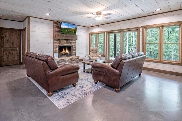 1085 Dills Rd, Blue Ridge, GA 30513 - living area featuring wood ceiling, a ceiling fan, finished concrete flooring, a stone fireplace, and recessed lighting