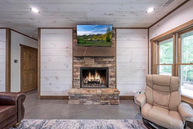 1085 Dills Rd, Blue Ridge, GA 30513 - living area featuring concrete flooring, recessed lighting, a stone fireplace, plenty of natural light, and wooden walls