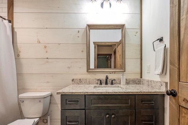 1085 Dills Rd, Blue Ridge, GA 30513 - full bathroom with toilet, vanity, and wooden walls