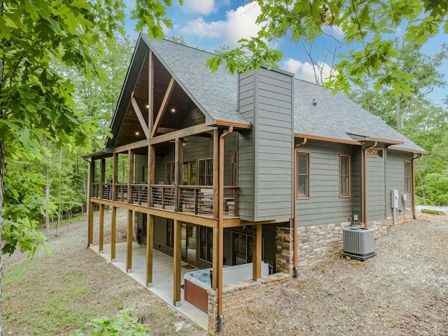 1085 Dills Rd, Blue Ridge, GA 30513 - rear view of house with cooling unit, a patio, a chimney, roof with shingles, and a wooden deck