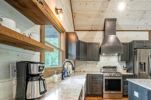 1085 Dills Rd, Blue Ridge, GA 30513 - kitchen with appliances with stainless steel finishes, light stone countertops, a sink, custom range hood, and open shelves