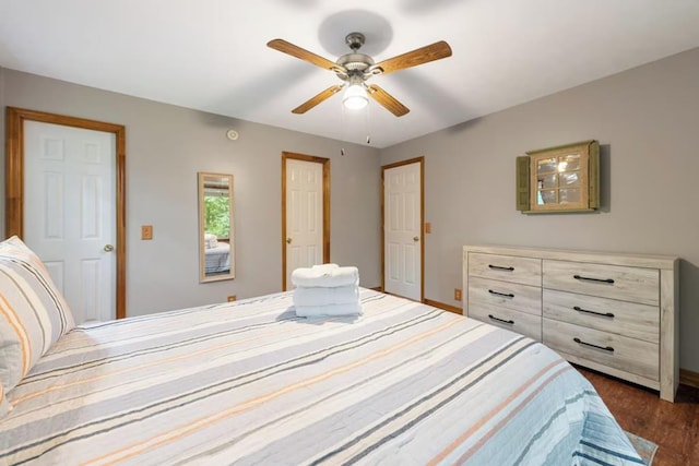 bedroom featuring dark wood-type flooring and ceiling fan