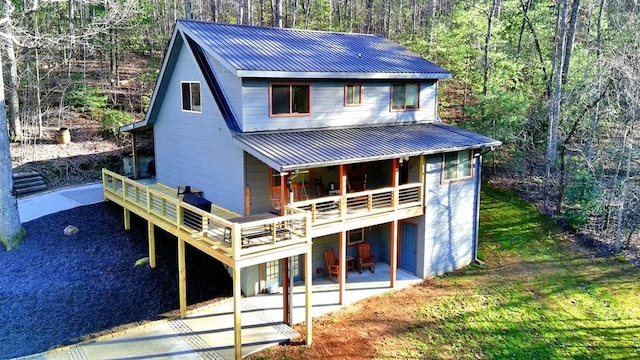 exterior space featuring a deck and a patio