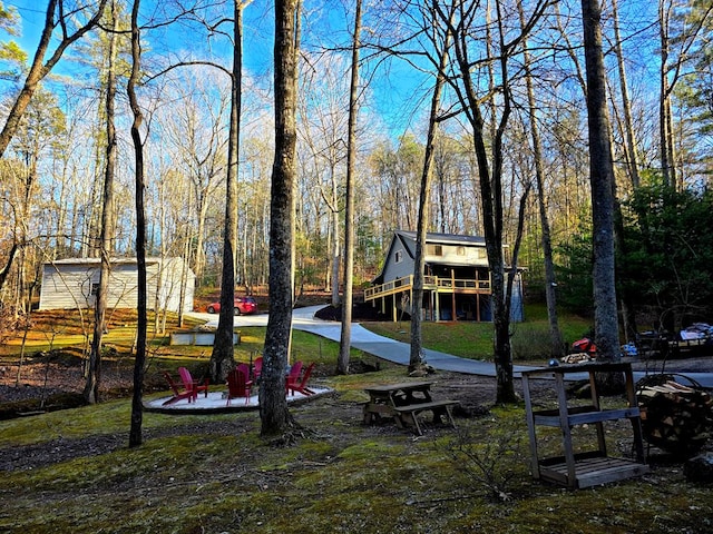 view of playground with an outdoor fire pit