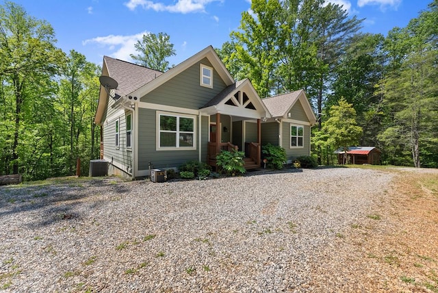457 Celie Ann Seabolt Rd, Cleveland, GA 30528 - view of front facade featuring central AC, a shingled roof, driveway, and covered porch