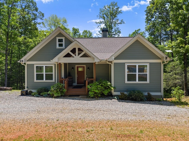 457 Celie Ann Seabolt Rd, Cleveland, GA 30528 - view of front of house with covered porch, a chimney, and roof with shingles