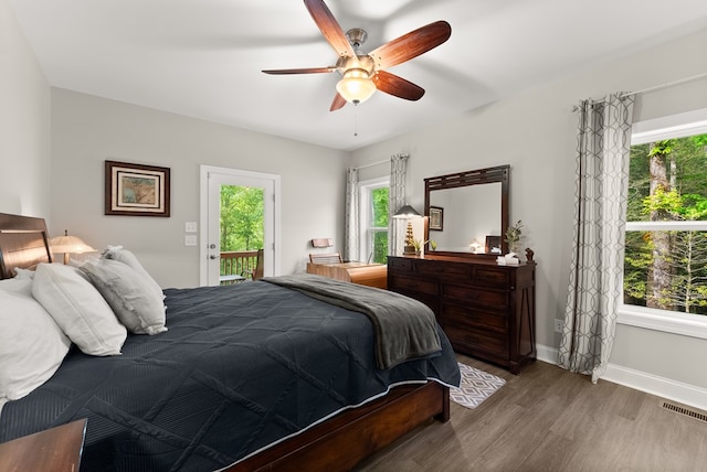 457 Celie Ann Seabolt Rd, Cleveland, GA 30528 - bedroom with access to exterior, wood finished floors, baseboards, and ceiling fan